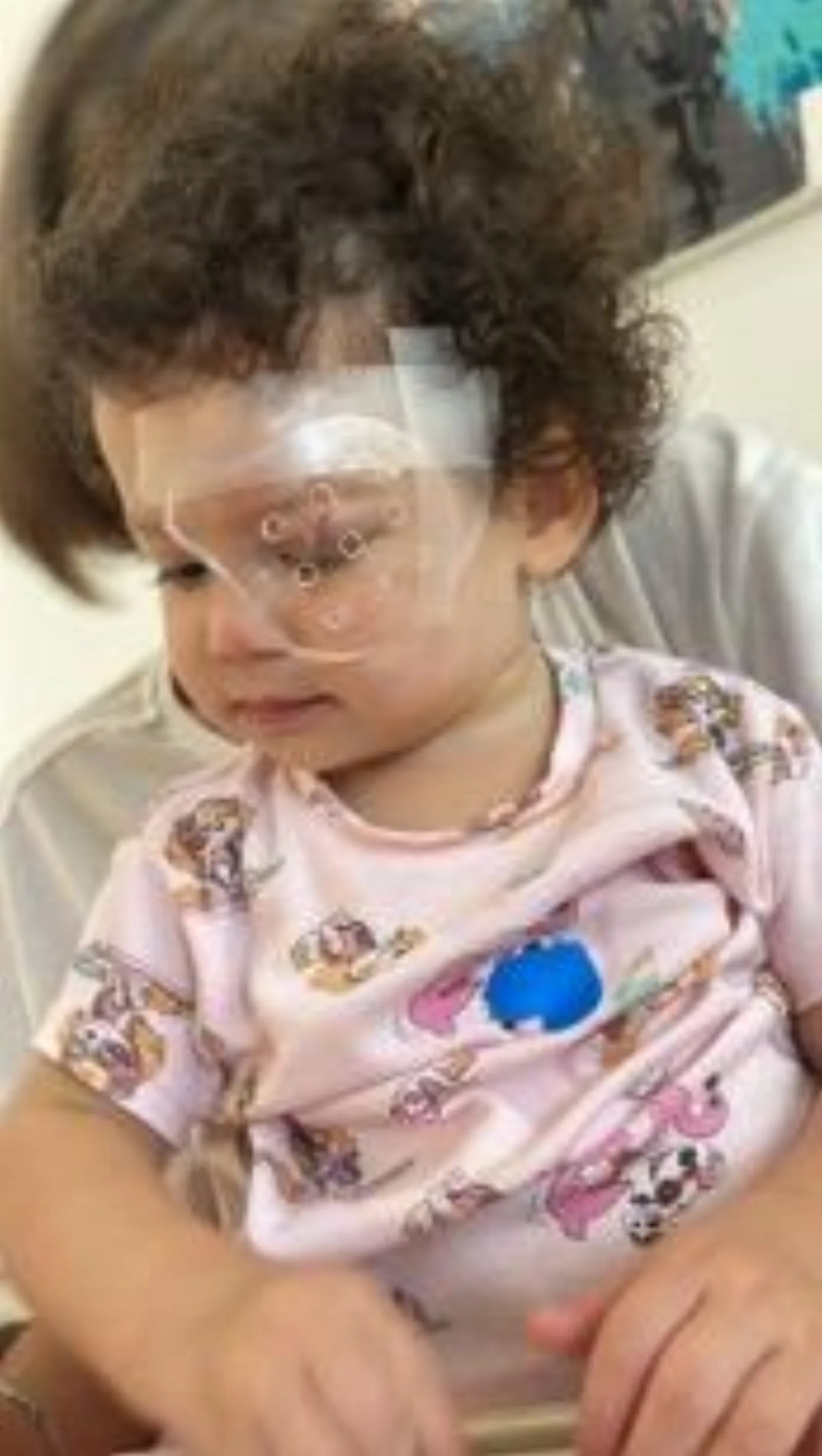 Romi wearing the protective device
